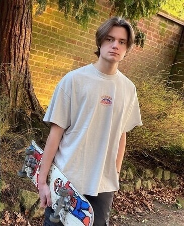 joseph wagland holding a skateboard