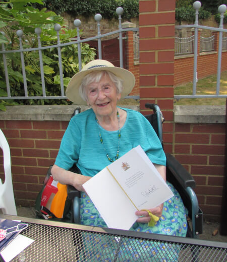Angela Hutor with 107th birthday card from the Queen