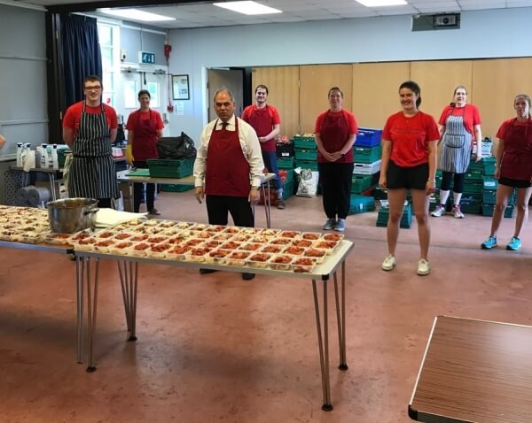 Enfield Southgate MP Bambos Charalambous with some of the Cooking Champions volunteers