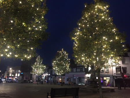 christmas lights on trees in church street enfield town