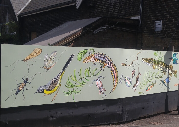 new river life mural at palmers green station