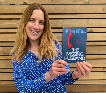 natasha boydell holding her debut novel the missing husband