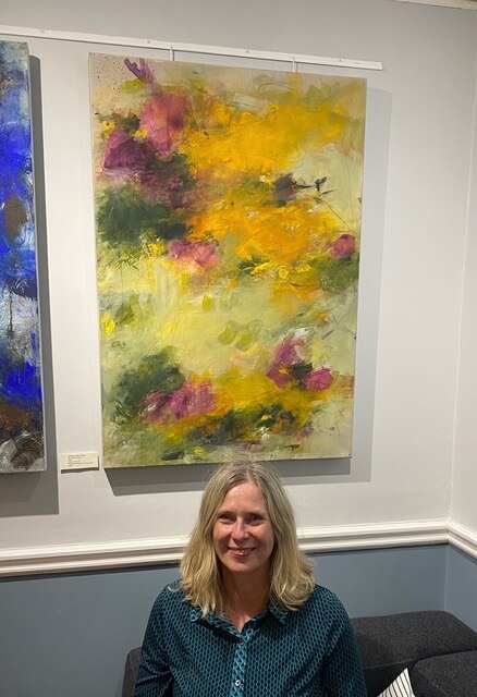 angela dierks and one of her paintings at the southgate club