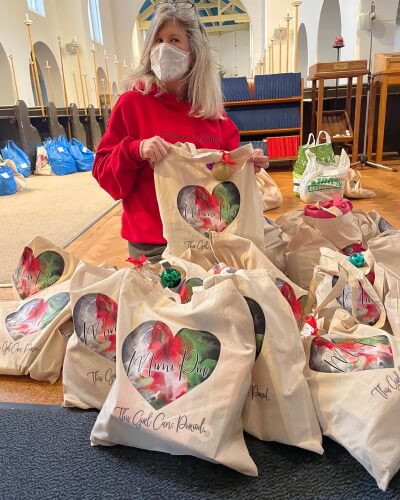 anne nichols packing bags of supplies as part of the this girl can period campaign