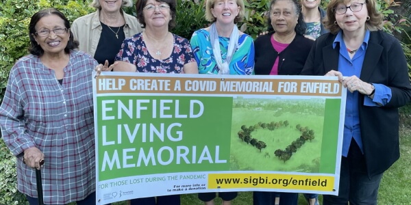 members of enfield soroptimists with placard advertising the enfield living memorial