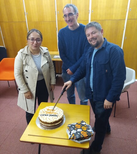 cutting the cake at the enfield dispatch 5th birthday event