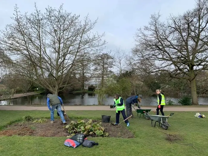 fobp volunteers planting a bed near a lake in broomfield park 1