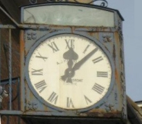 Photo of clock outside shop in Palmers Green